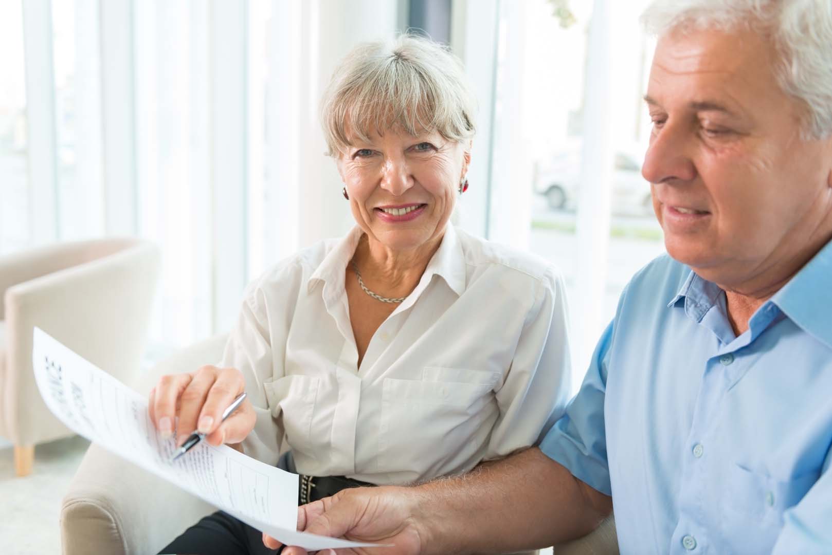 Medical professional handing card to patient 