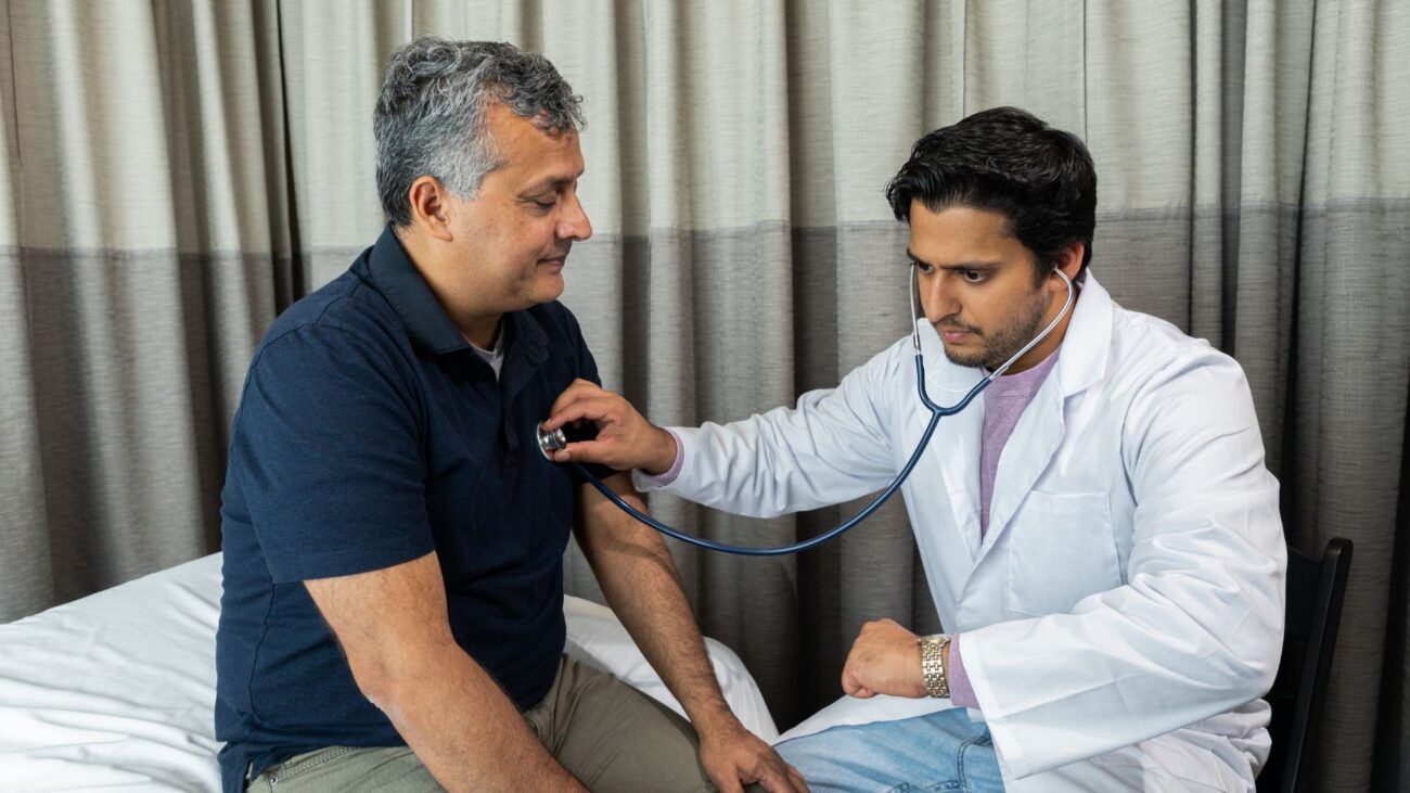 Man receiving health check up from doctor